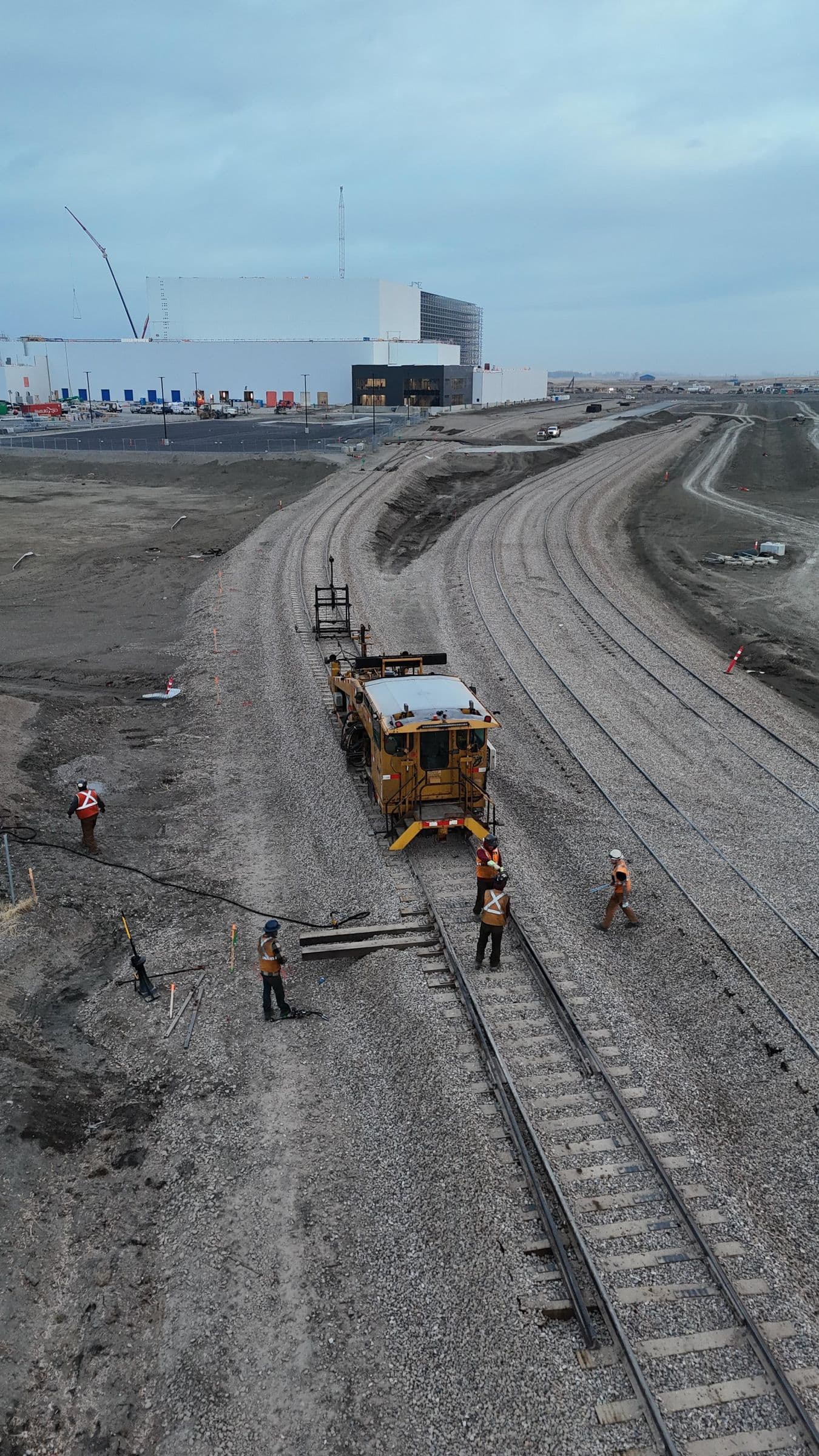 Crew working alongside a surfacing machine on the new spur track