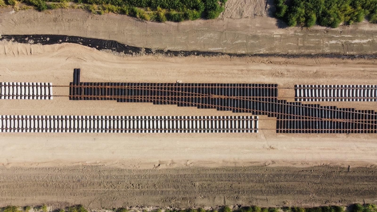 Aerial view of new track panels and a turnout being assembled