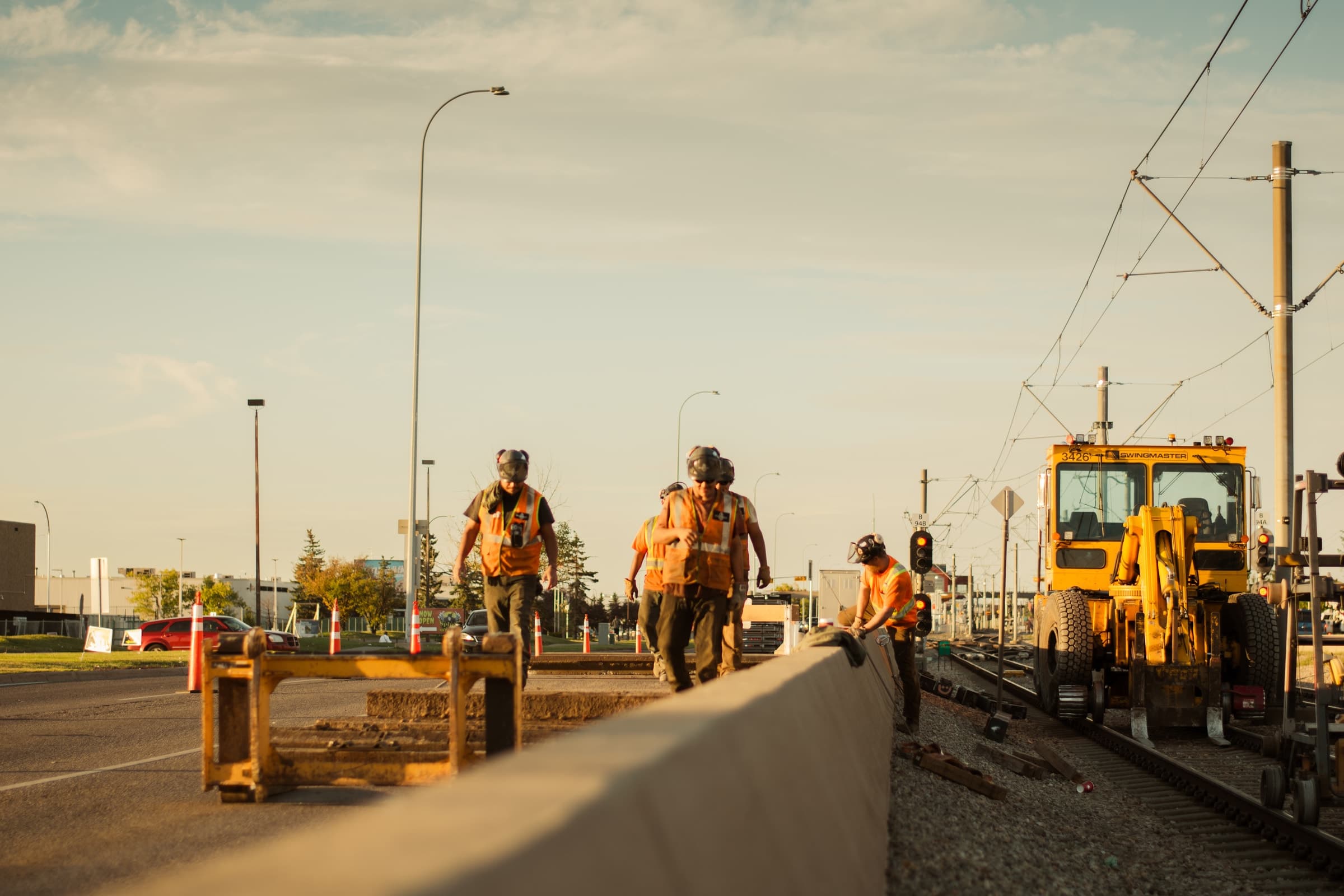 Ironhorse field crew working beside railway track and construction equipment